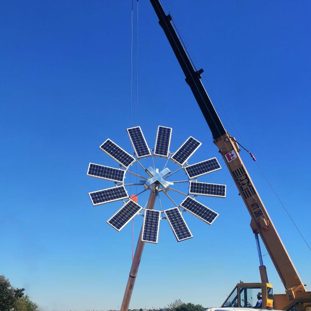 Solar masts installed along pathways in a modern residential estate, providing efficient lighting.